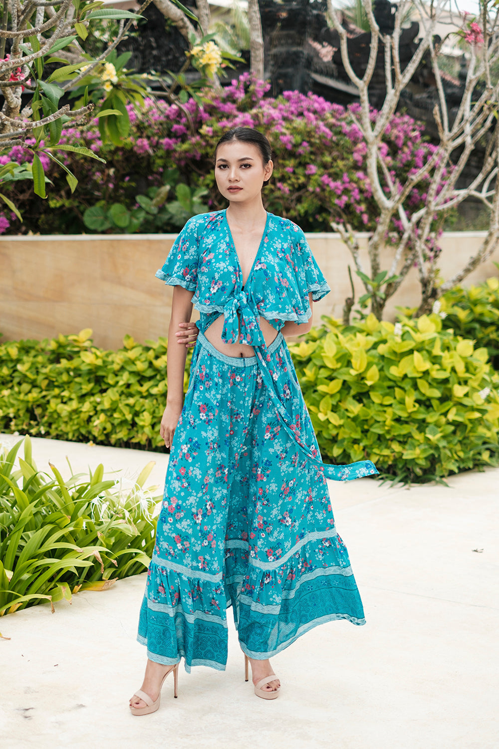 The Tumi Cape Dress by Tulle and Batiste, available in all sizes, with complimentary custom tailoring for the perfect fit.