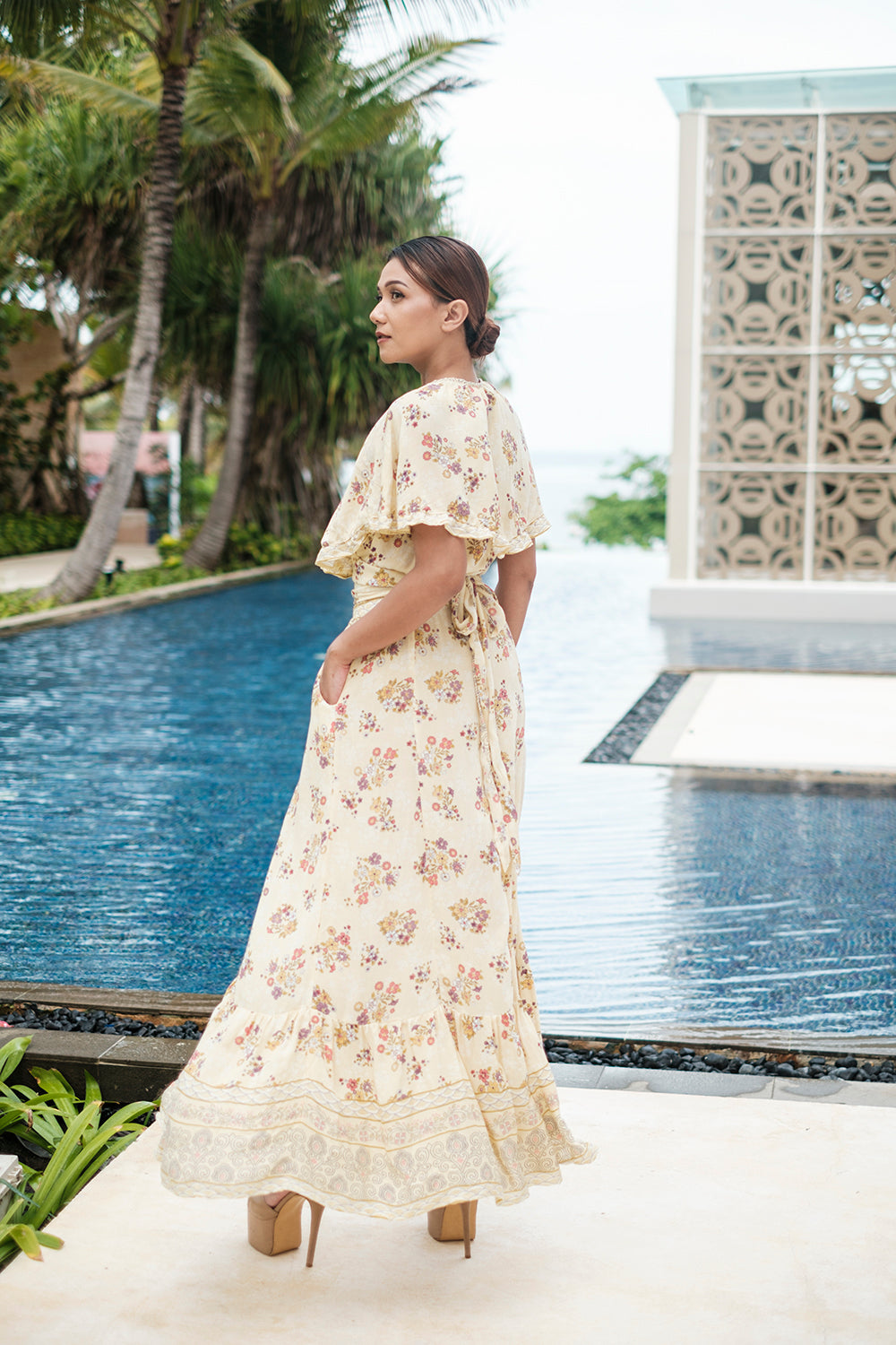 The Tumi Cape Dress by Tulle and Batiste, a modern bohemian style designed to be timeless and versatile.
