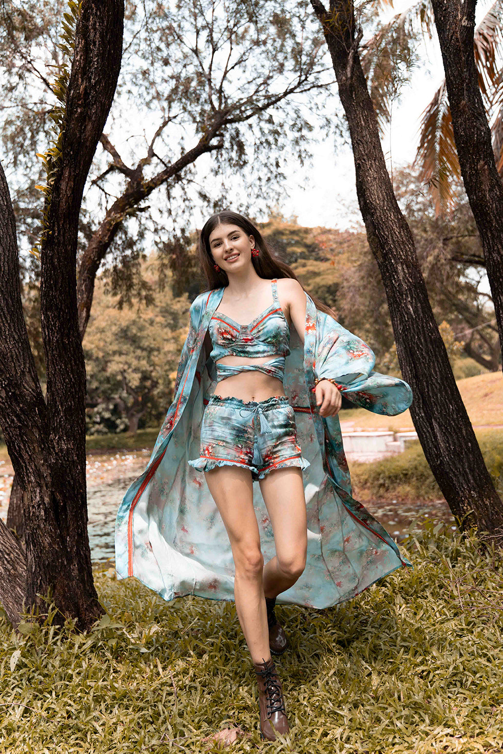 Embrace the spirit of wanderlust with the Moriko Kimono's dreamy forest blue hues, evoking the tranquility of nature and the vibrant energy of bohemian culture.